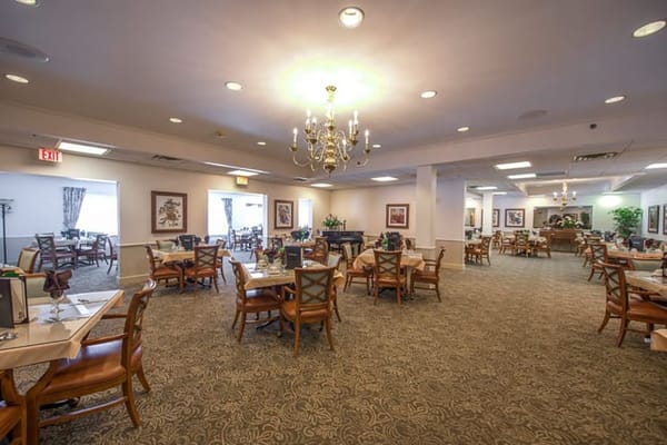 Dining room with tables set for residents