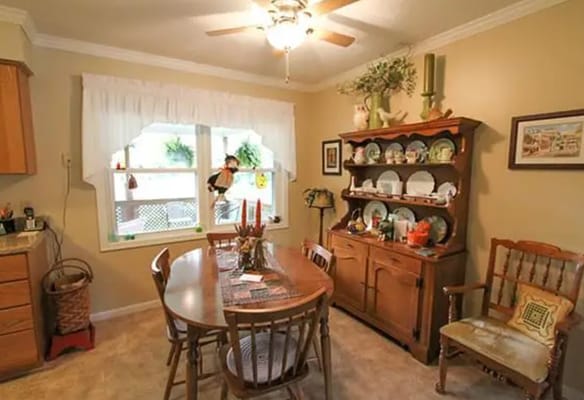 Dining area with a table and decorative cabinet
