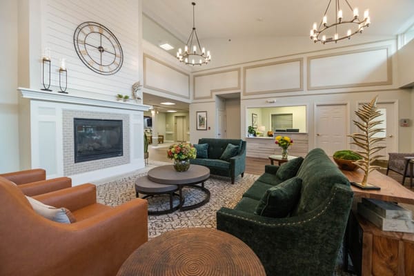 Cozy lobby area with comfortable seating and a fireplace.