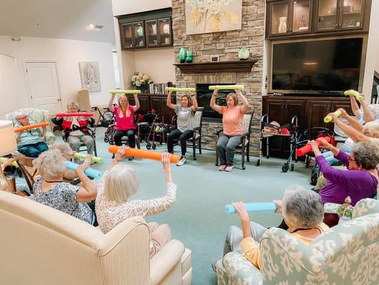 Residents participating in a group exercise activity