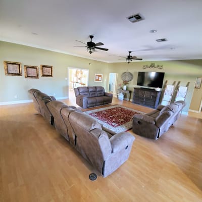 Spacious living room with comfortable seating and a TV