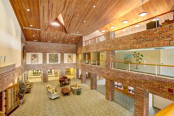 Interior view of a spacious common area with seating