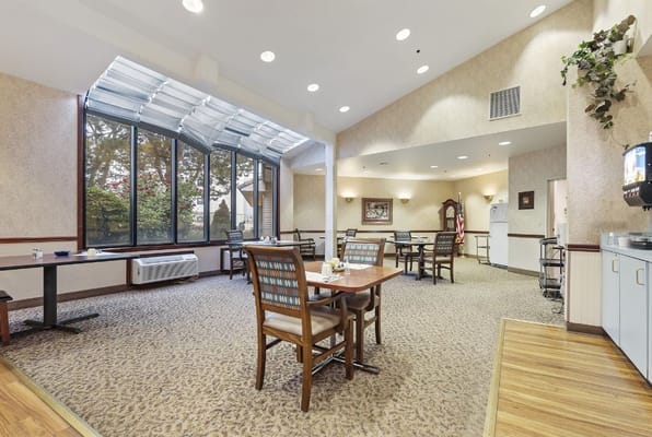 Bright common area with tables and chairs