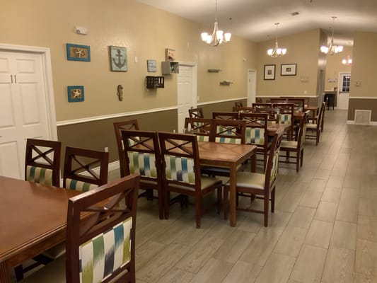 Dining area with wooden tables and chairs