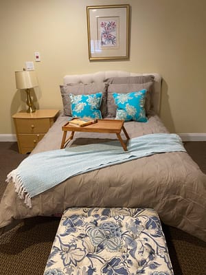 Cozy bedroom setup with clean linens and decorative accents