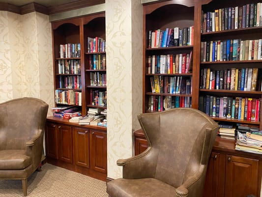 Interior view of a cozy reading area with bookshelves