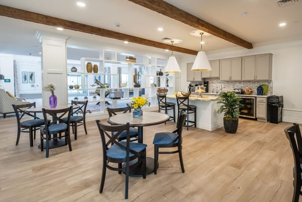 Bright common area with tables and chairs