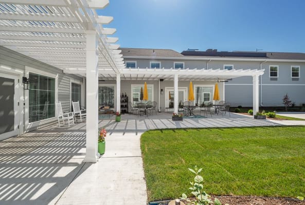Outdoor gathering area with seating and umbrellas