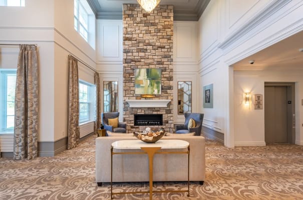 Bright common area with comfortable seating and fireplace