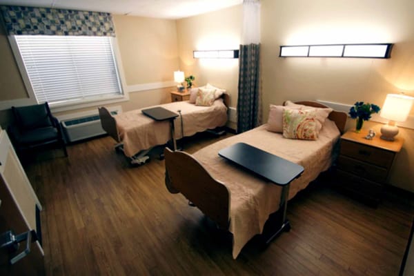 Cozy resident room with two beds and decor