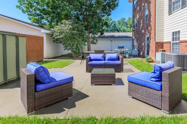 Outdoor seating area with blue cushions