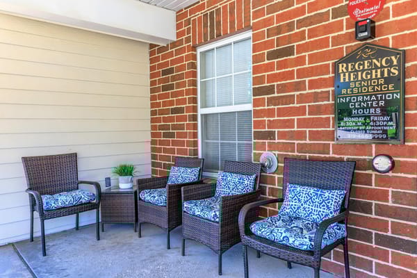 Outdoor seating area with wicker chairs and decor