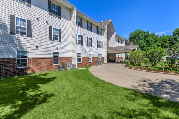 Exterior view of Regency Heights Senior Apartments with manicured lawn