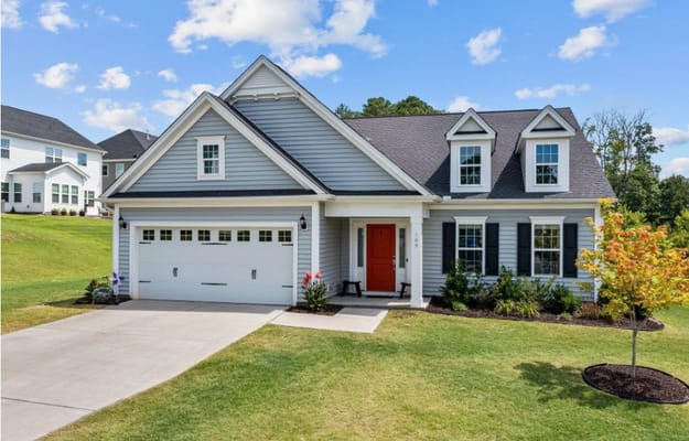 Exterior view of a residential-style facility with gardens