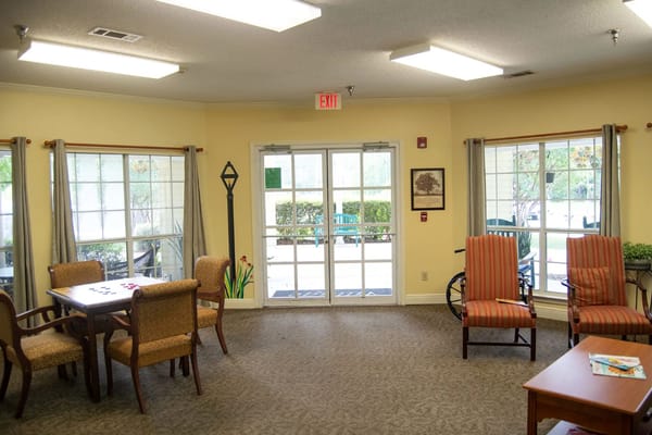 Bright and inviting common area with seating and large windows