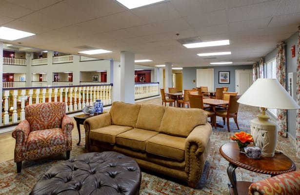 Comfortable seating area with couches and tables in the lounge