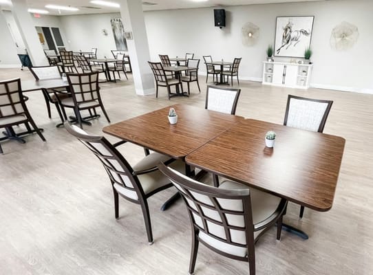 Clean dining area with tables and chairs