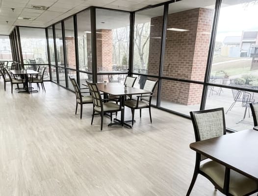 Bright common area with tables and chairs