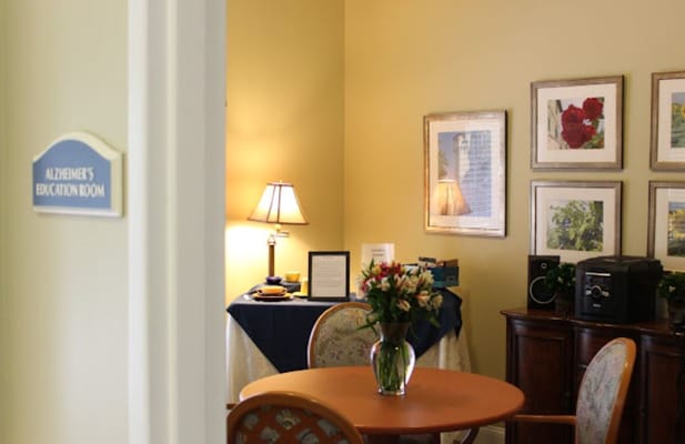 Interior of the Alzheimer's education room with a table and flowers