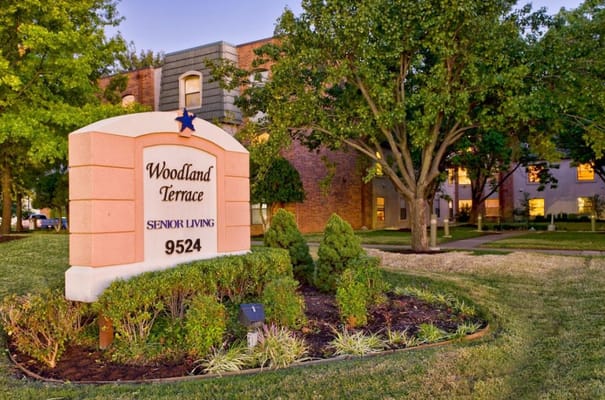 Signage for Woodland Terrace at sunset