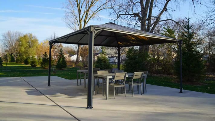 Covered outdoor seating area with tables and chairs