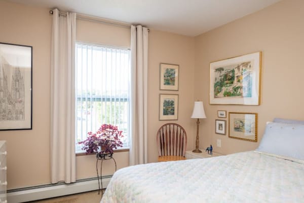 Well-furnished private bedroom in a senior living facility