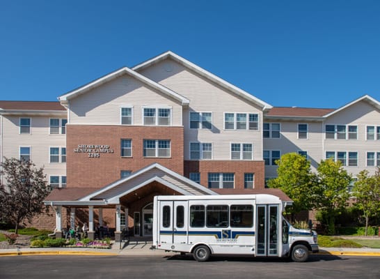 Exterior view of Shorewood Senior Campus with facility shuttle