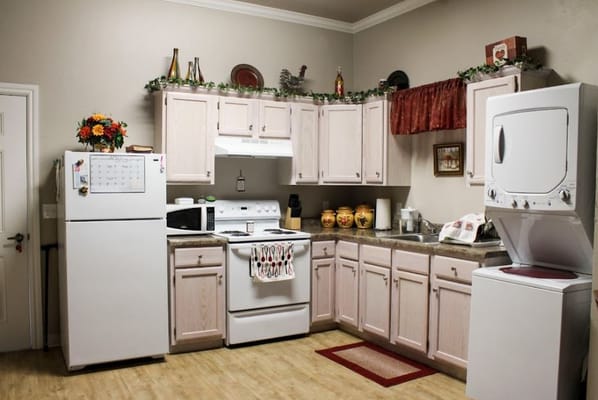 Interior kitchen space with appliances and decorations
