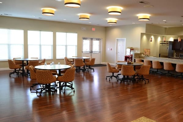 Bright common area with tables and chairs