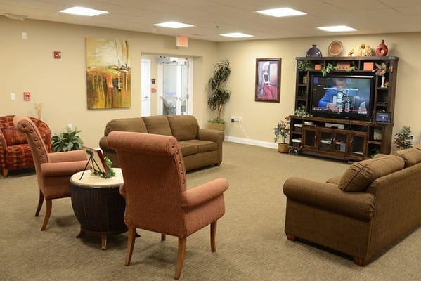 Cozy living room with seating and a TV at Silvercrest at Deer Creek.