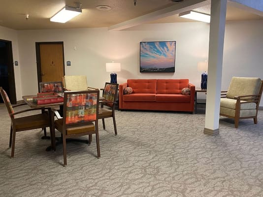 Bright common area with seating and artwork