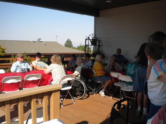 Group of seniors socializing on a patio