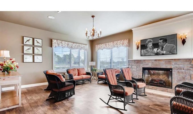 Cozy living room with rocking chairs and a fireplace