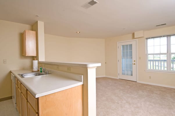 View of a kitchen and living area in a senior apartment