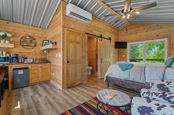 Cozy interior of a wooden cabin room with amenities