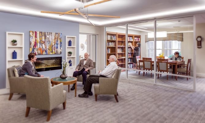 Residents engaging in conversation in the lounge area.