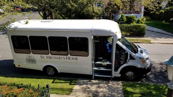 Transportation bus of St. Michael's Home parked on the street