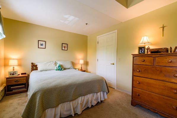 Cozy private resident room with bed and dresser