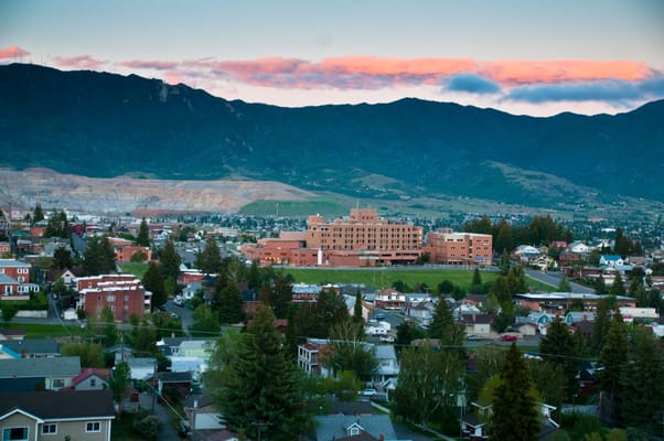 Aerial view of St. James Healthcare facility surrounded by mountains