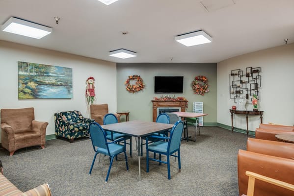 Cozy common area with seating and decorative wreaths