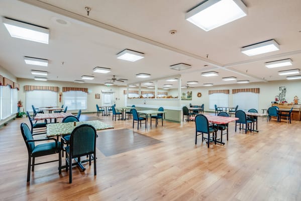 Bright dining area with tables and chairs at Stonebridge Adams Street