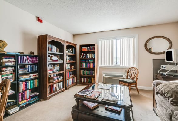 Cozy reading area with bookshelves and comfortable seating