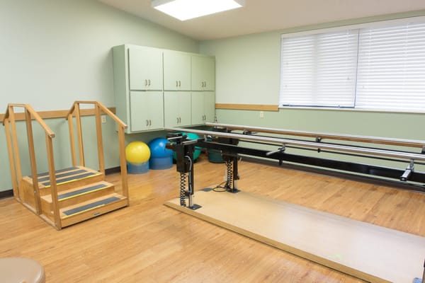 Therapy room with stairs and rehabilitation equipment