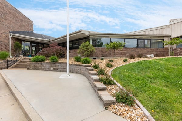Main entrance with landscaped garden at Stonebridge Villa Marie