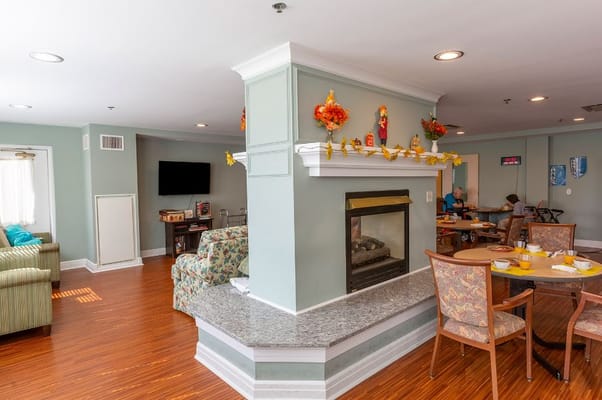 Comfortable lounge area with seating and a fireplace