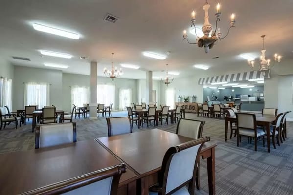 Dining area with tables and chairs in a well-lit setting