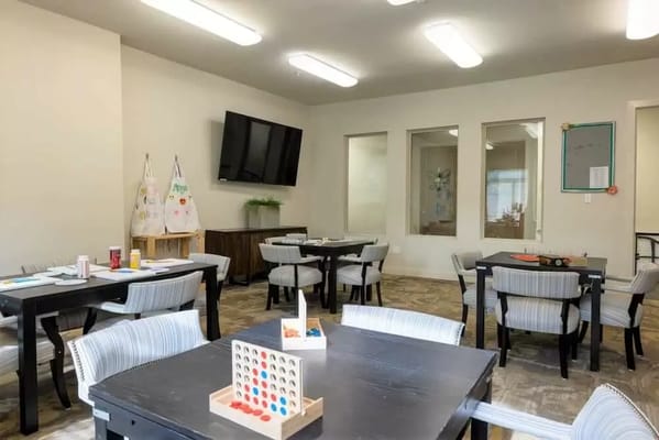 Bright activity room with tables and games