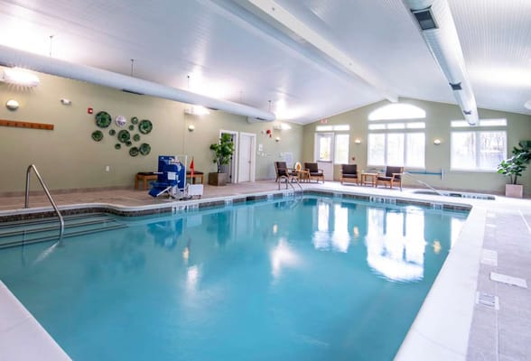 Indoor swimming pool with seating area