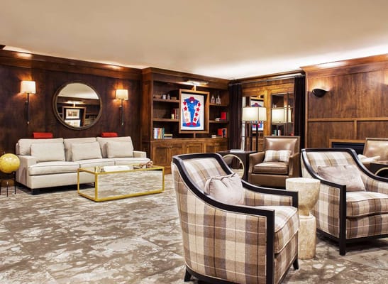 Spacious lounge area with seating and decorative elements