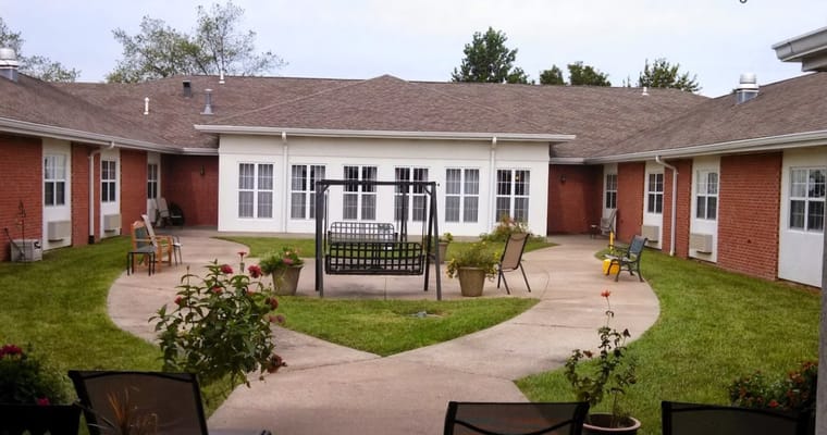 Outdoor courtyard with seating and swing